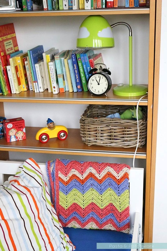 Colourful toddler bedroom - love the mixture of cheaper IKEA items with vintage toys and a handmade crochet blanket