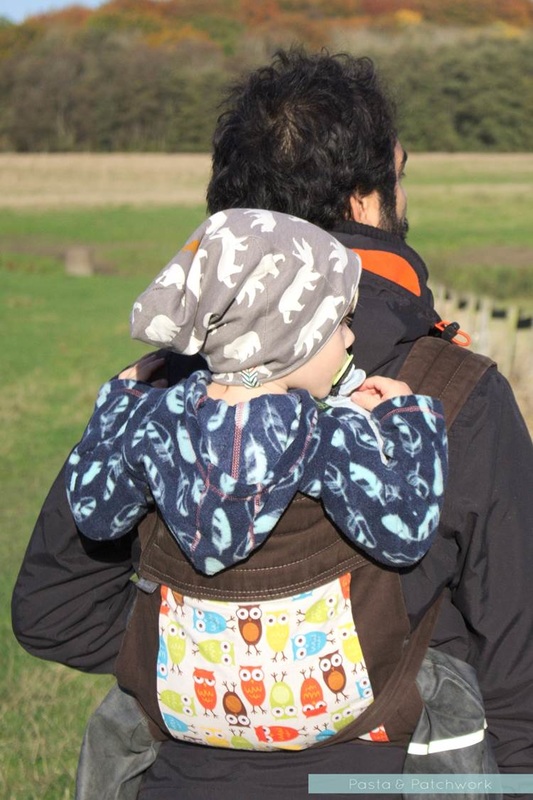 Toddler being carried in the BabyHawk mei-tai style sling