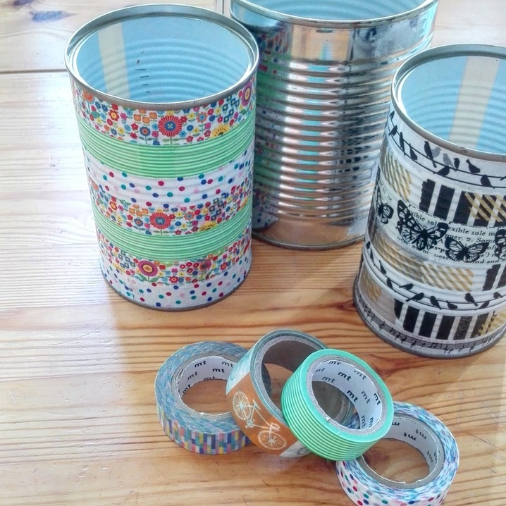 Small Storage | Use empty food tins and washi tape to create pretty storage for pens, paint brushes, etc.