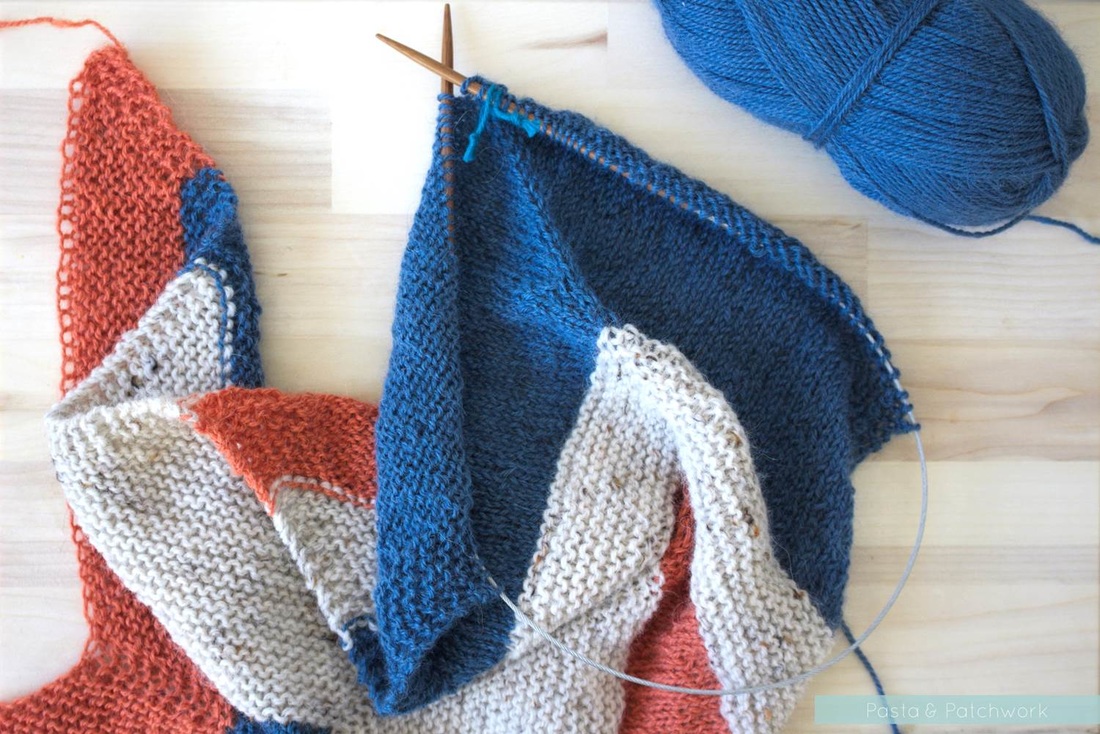Orange, indigo and white version of the Blue Bell Hill Scarf by O-wool